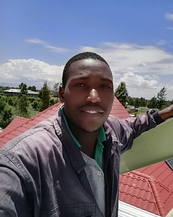 Vegaz technician on a tiled roof during a solar installation