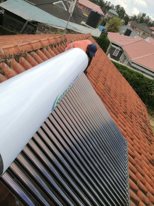 Solar water heater tank and tubes on a roof