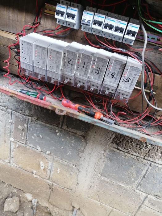 Distribution board with labelled circuit breakers during wiring